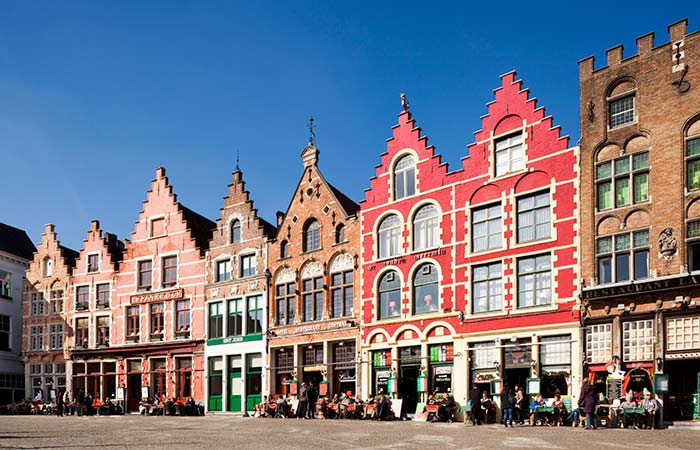 Pretty little houses in Bruges, the setting for the escapades of two hopeless hitmen. Image: Getty.
