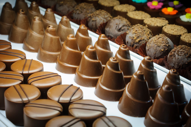 A close-up of chocolates in rows.