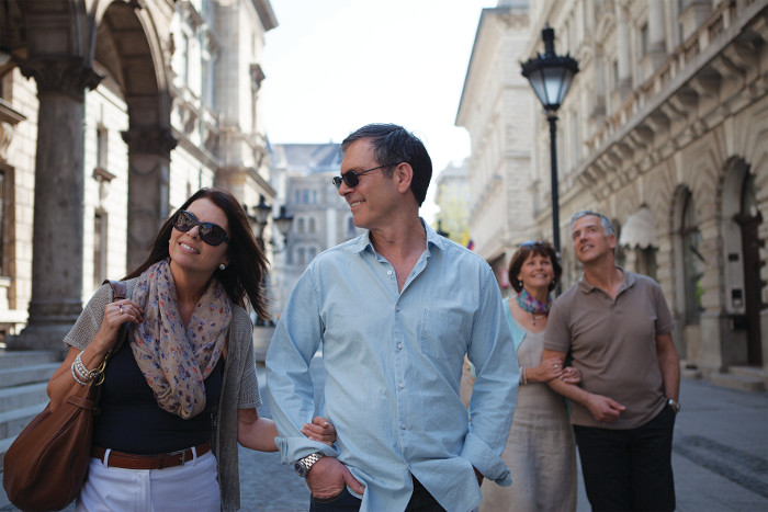 couple walking in European city APT touring