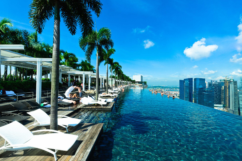 The infinity rooftop pool at Marina Bay Sands overlooking the Singapore skyline.