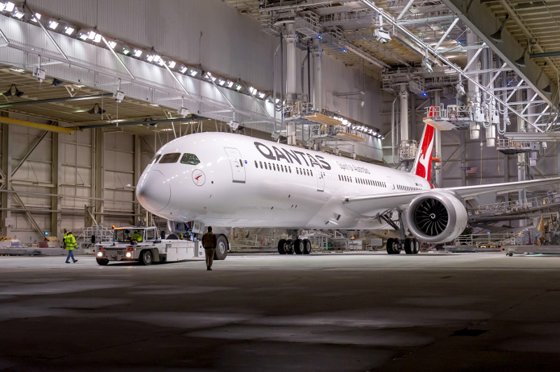 Qantas' Dreamliner rolling out of the Seattle Boeing factory, where over 700 staff work to output one single aircraft 