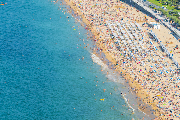 Busy beach in San Sebastian, Spain