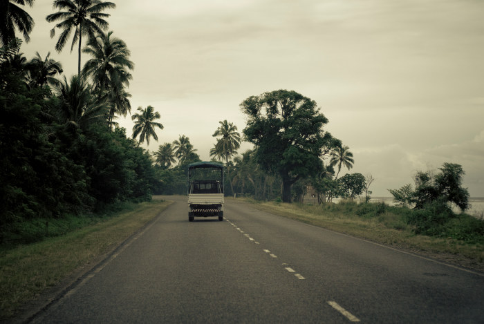 Small truck driving along road in Fiji