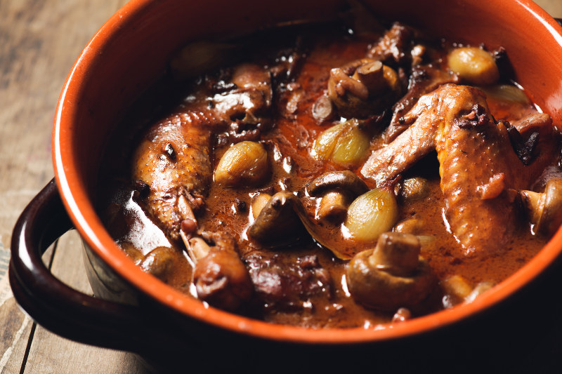 Coq au vin, chicken stew in bowl