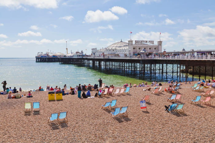 Brighton pier and beach on a sunny day, UK