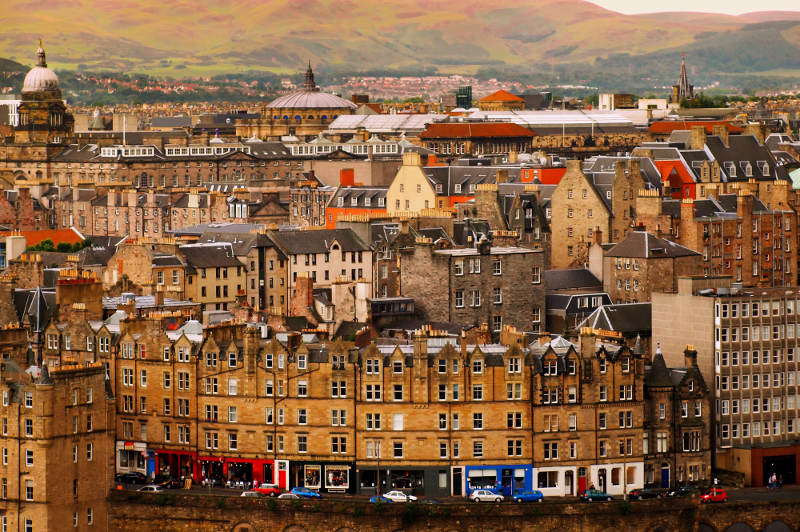 overlooking georgian buildings in edingburgh with mountains in background