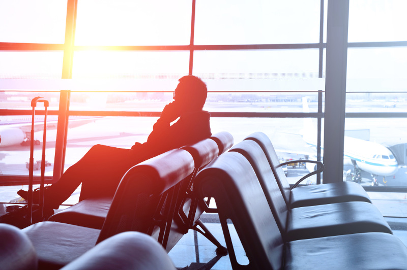 man on phone in airport