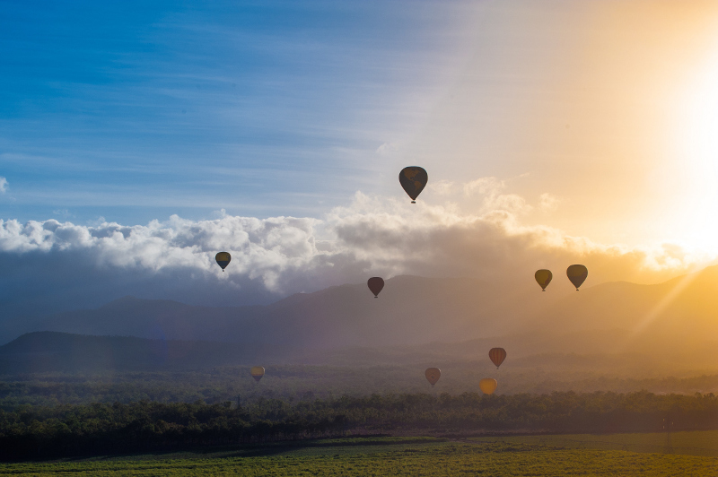 Hot air balloons rise over the Atherton Tablelands