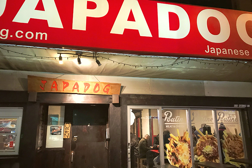 Exterior of Japadog eatery in Vancouver at night