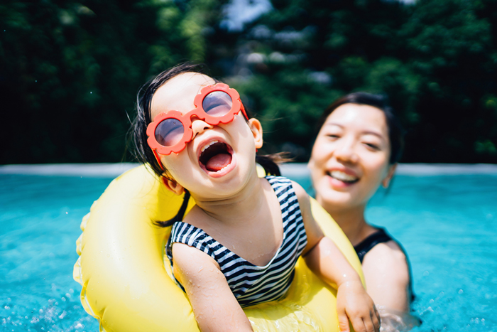 mother daughter in pool - life lessons from travelling with children