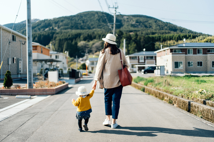 mother and daughter walking together - life lessons from travelling with a toddler