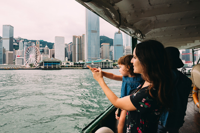 daughter and mum on kowloon ferry - life lessons from travelling with kids