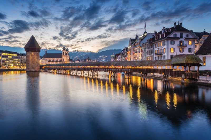 Sunset at Chapel Bridge in Lucerne. Image: Getty