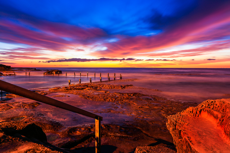 rock pool and stairs into pool sunrise