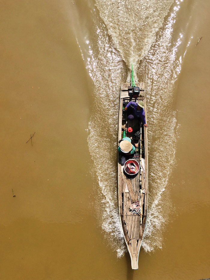 a view of a river boat from above near Evergreen Island, Vietnam - Mekong River cruise