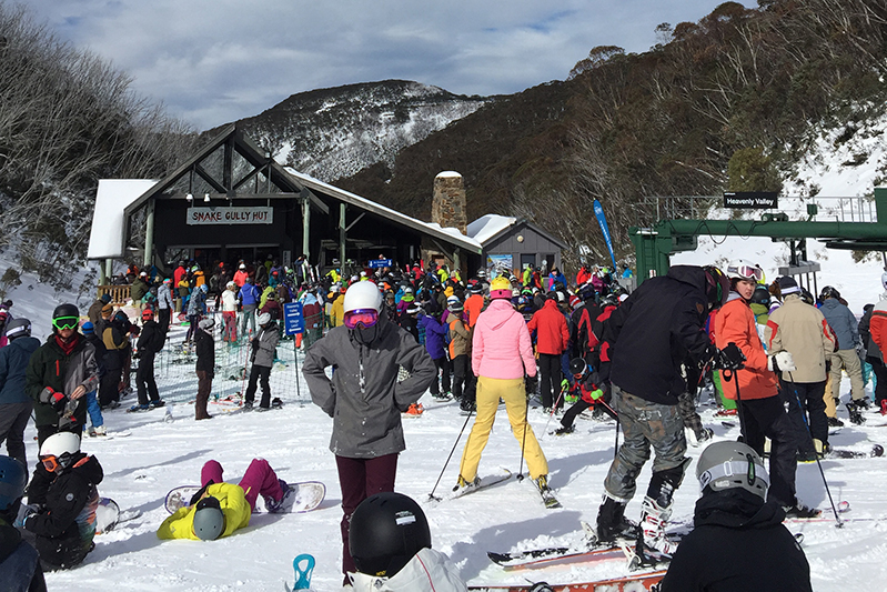 Skiers wait for the chairlift at Mount Hotham