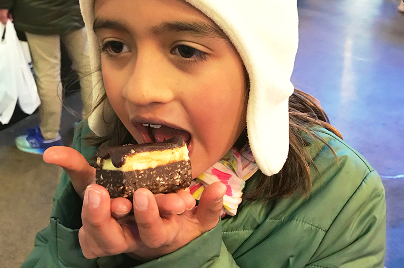 Child eating a Nainamo bar