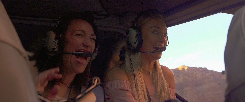 greer and kelly in helicopter over grand canyon