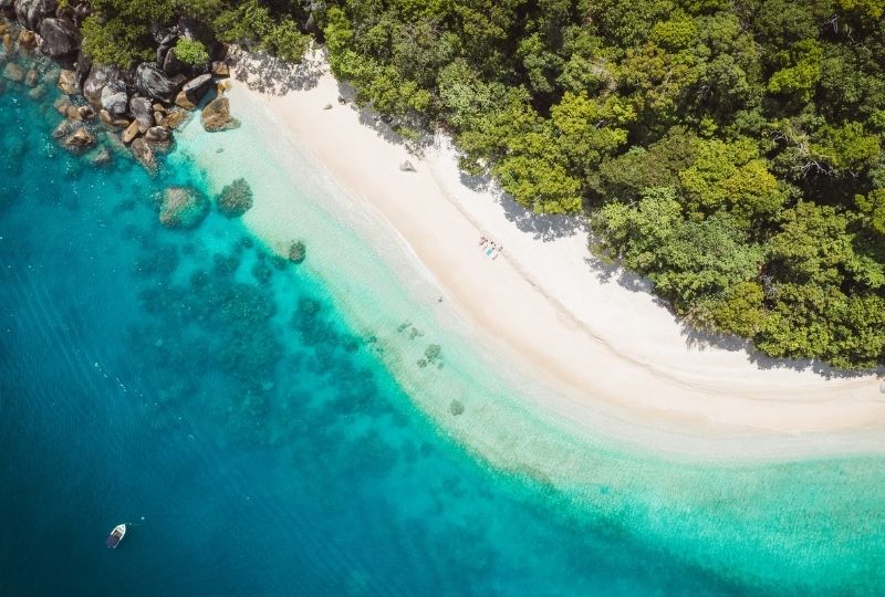 Image looking down on a white sandy beach