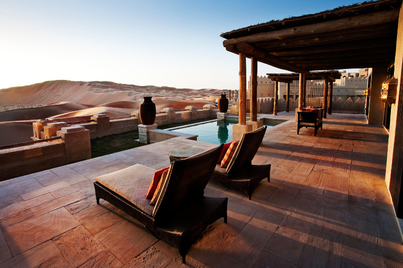 loungers overlooking pool luxury getaway in desert