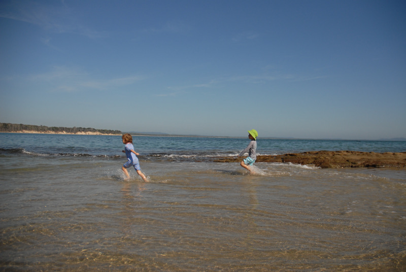Two children having fun at the beach