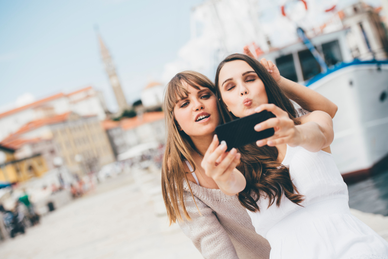Friends taking a selfie in Europe.