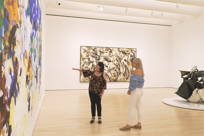 Two women admire the artworks inside SFMOMA.