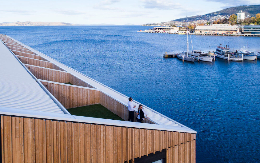 Image of couple on rooftop of MACq 01 looking out over the harbour in Hobart