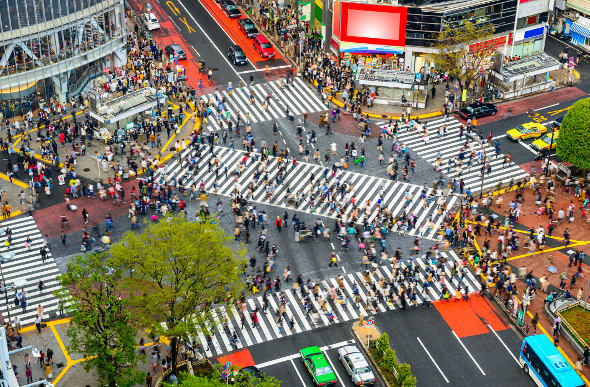 Crowd of people crossing the Shibuya Crossing in Tokyo 