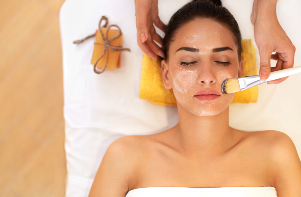 A woman receiving a facial.