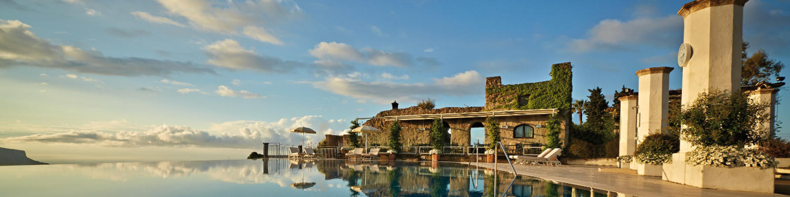 A stunning infinity edge pool reflecting the blue skies
