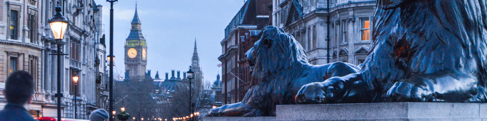 lions in trafalgar square london at dusk