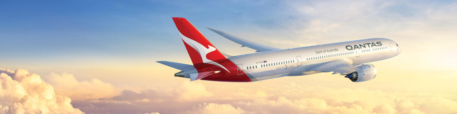 The Qantas Dreamliner flies through the clouds.