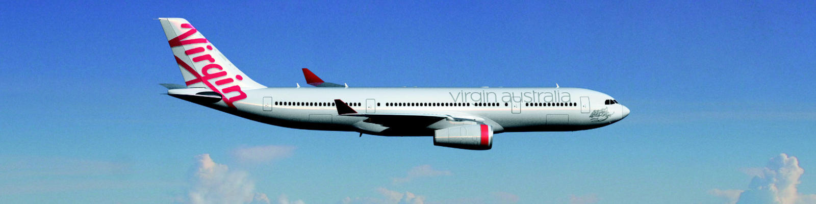 Virgin Australia airplane flying through blue skies with fluffy clouds in the background