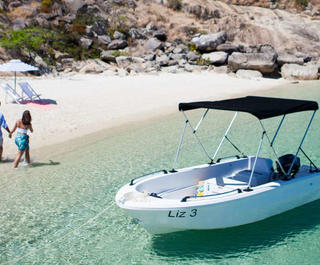 couple having picnic on secluded beach on lizard island qld