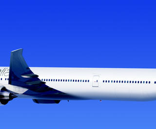 A Virgin Australia airplane flying through blue skies