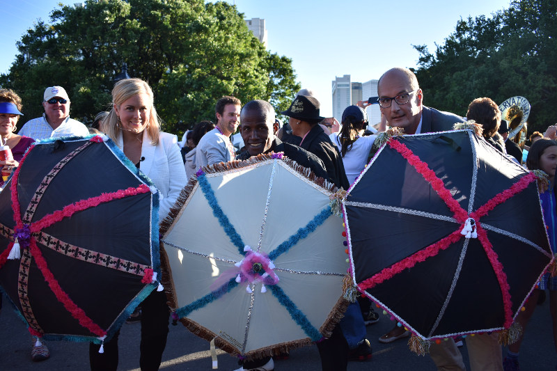 Samantha Armytage and David Koch hold umbrellas during the French Quarter Festival in New Orleans, USA.