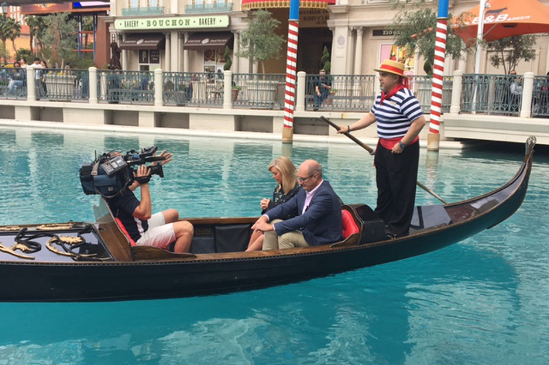 A cameraman films Sunrise hosts Samantha Armytage and David Koch, as well as a gondolier, in a gondola at The Venetian in Las Vegas, USA.