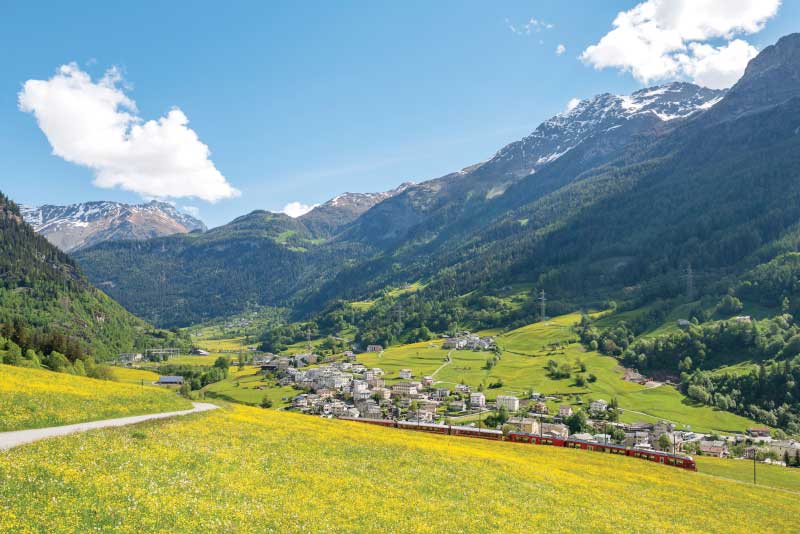 Bernina Express traverses Poschiavo Valley in spring. Image: Getty
