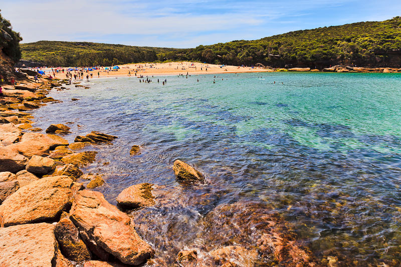 Simmers enjoy the beach at beautiful Wattamolla in Sydney's Royal National Park.