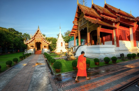 thai temple with man infront