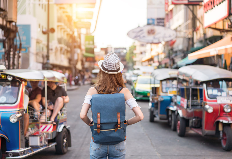 woman in bangkok walking down street