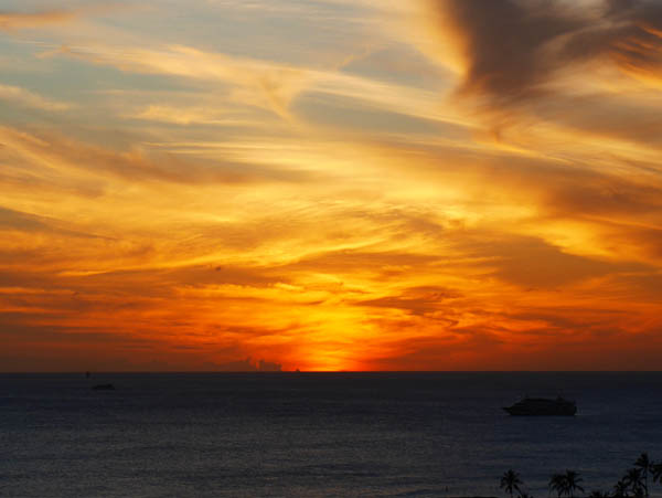 The sunset view from the balcony of The Modern Honolulu ocean-view suite