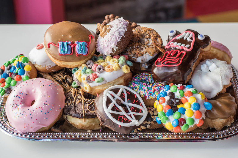 plate of colourful doughnuts